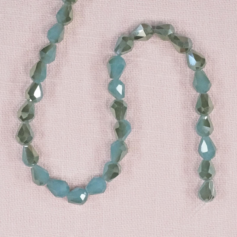 7 mm by 5 mm faceted aqua glass teardrop beads