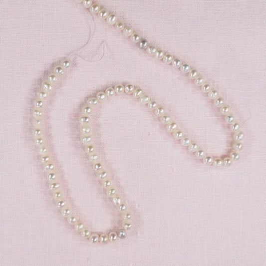 2 mm oval cream pearls