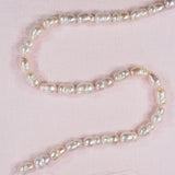 12 mm to 14 mm oval ringed cream pearls