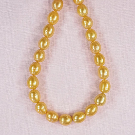 14 mm bright gold oval pearls