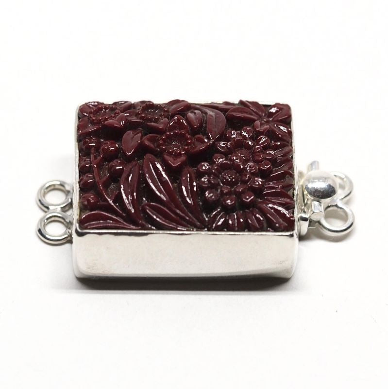 Maroon flower clasp