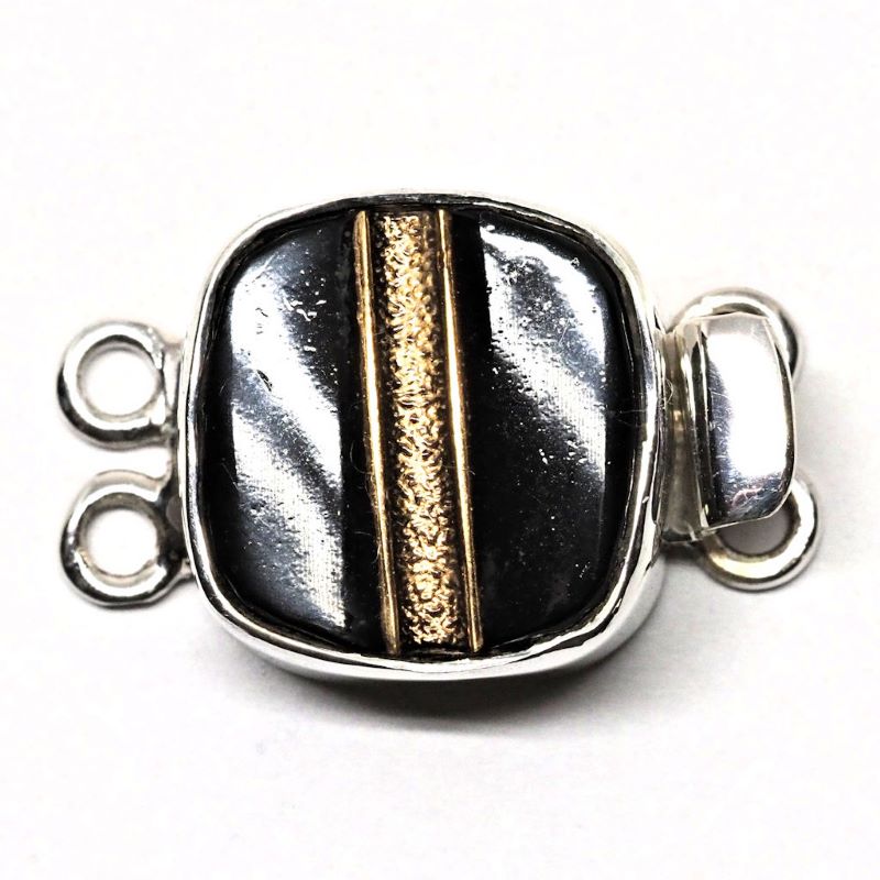 Black and gold tailored clasp