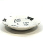 Black and white playful cat sauce dish