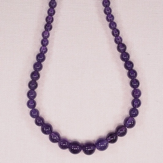 Graduated amethyst bead strand