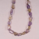 Faceted ametrine chunks