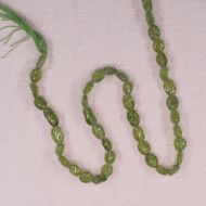 Hand-carved 8 mm by 6 mm peridot oval beads